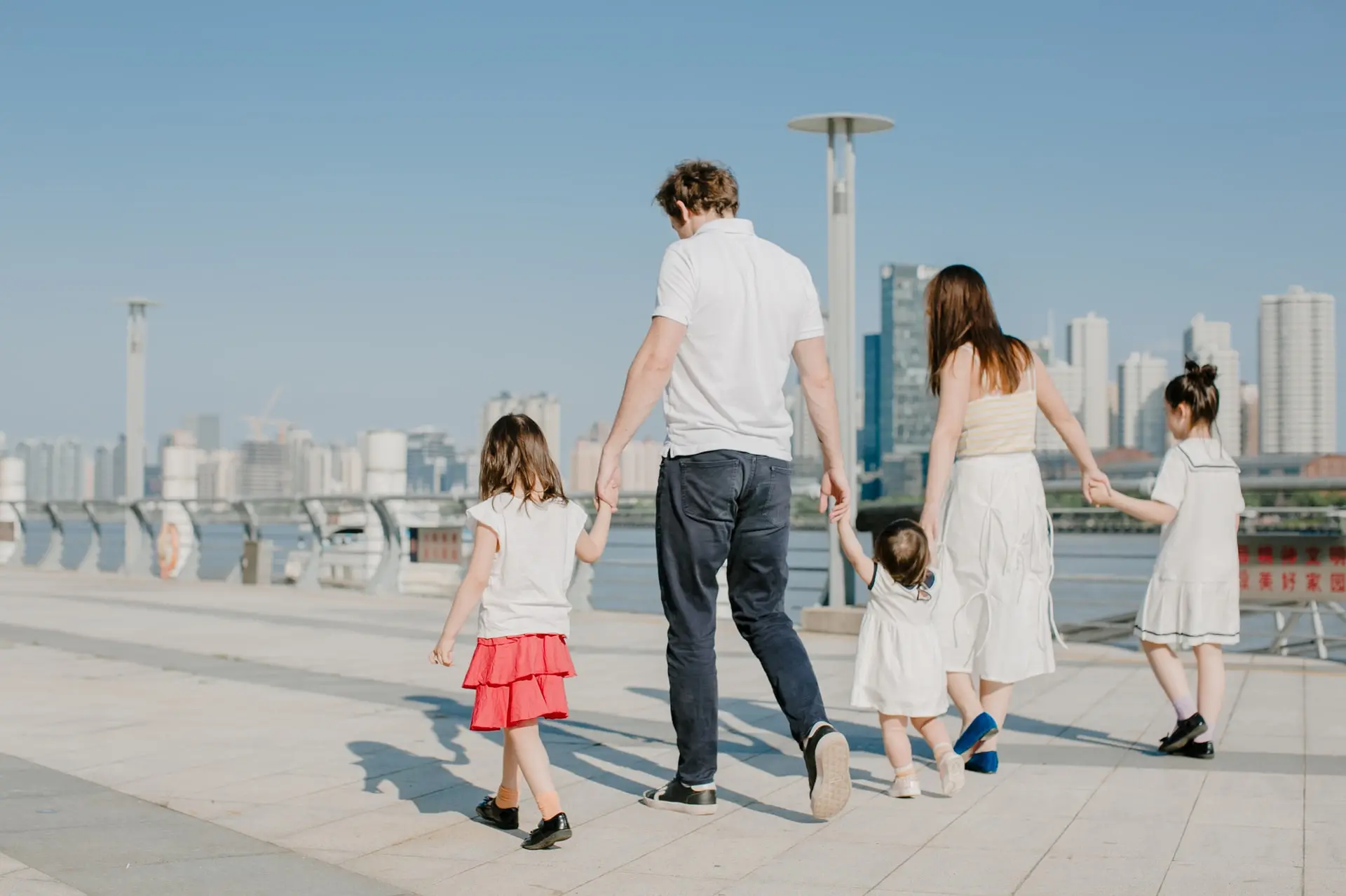 Happy family walking together outside