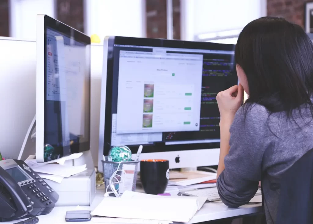 A woman working on laptop in office